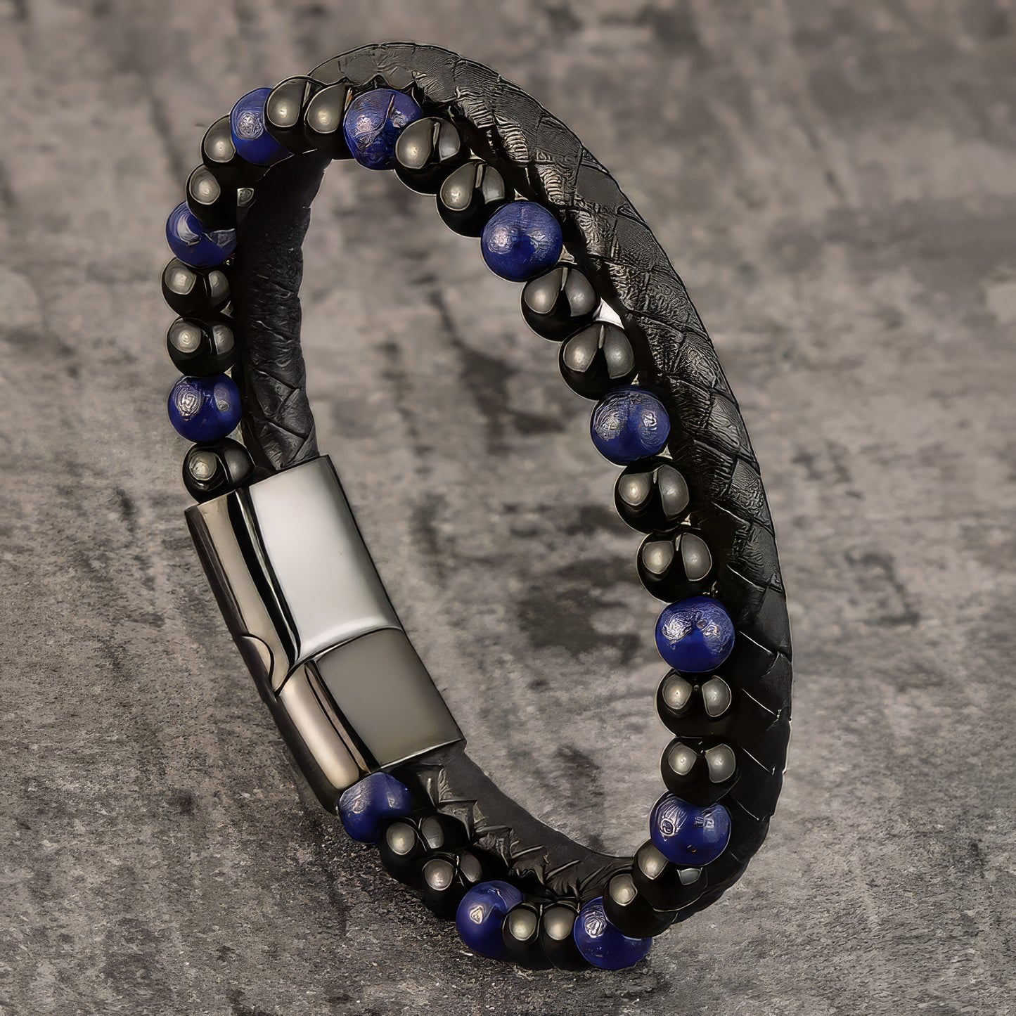 A Versatile design combining a braided rope and dark blue beaded band on black leather for a unique layered look.