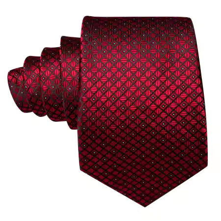 Burgundy-red silk tie rolled flat, showing detailed weave and pattern on a white background.”