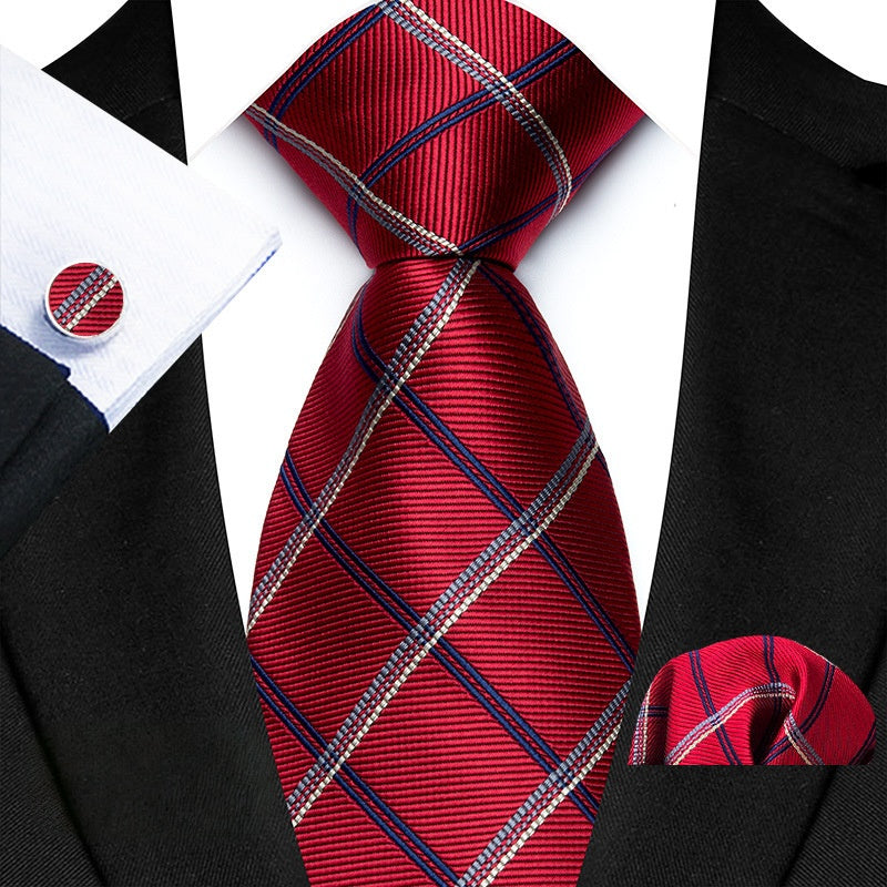 This Regal Red Tie Set with Navy Blue and White diagonal lines is the perfect addition to any formal outfit. Made with high-quality materials, the set includes a tie, matching cufflinks, and pocket squares. The bold and stylish design adds a touch of sophistication and professionalism to any look. Elevate your style with this must-have accessory set.