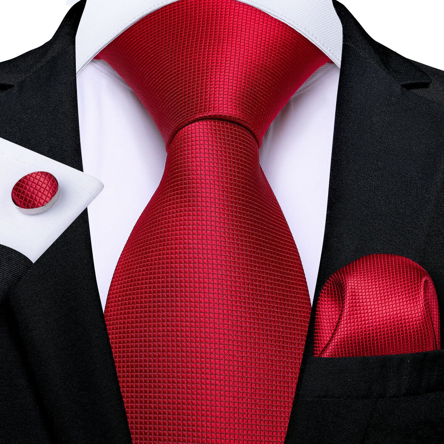 “58-inch crimson red textured silk tie set with matching pocket square (9" x 9") and cufflinks, styled on white shirt with black suit.”