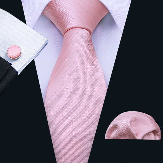 "Premium silk tie set in Solid Pink with texture Diagonal Lines, including a matching pocket square and cufflinks. Sophisticated and versatile for any occasion. Crafted for timeless elegance."