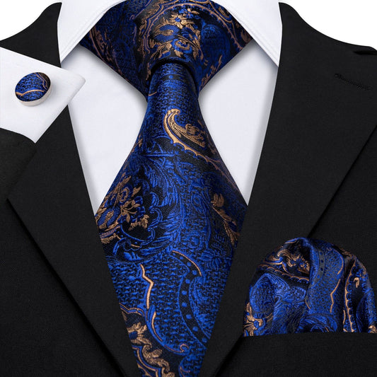 "Premium silk tie set in Blue and Gold Paisley, including a matching pocket square and cufflinks. Sophisticated and versatile for any occasion. Crafted for timeless elegance."