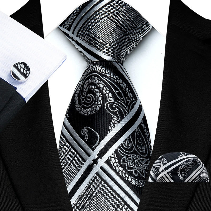 Add a touch of sophistication to your wardrobe with our Black and Silver Pattern Tie Set. Featuring double silver crisscrossing lines, this tie set exudes a sleek and stylish look. Elevate any outfit with this versatile accessory.