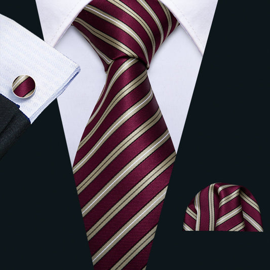 "Premium silk tie set in Burgundy with Stripes, including a matching pocket square and cufflinks. Sophisticated and versatile for any occasion. Crafted for timeless elegance."