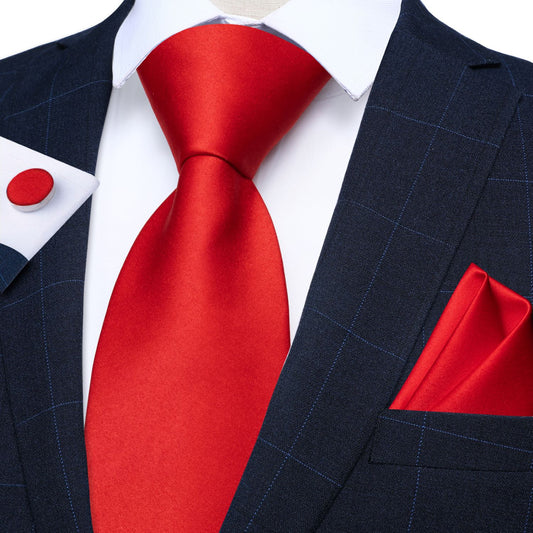 "Premium silk tie set in Solid Red, including a matching pocket square and cufflinks. Sophisticated and versatile for any occasion. Crafted for timeless elegance."