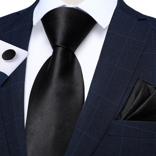 "Premium silk tie set in Solid Black, including a matching pocket square and cufflinks. Sophisticated and versatile for any occasion. Crafted for timeless elegance."