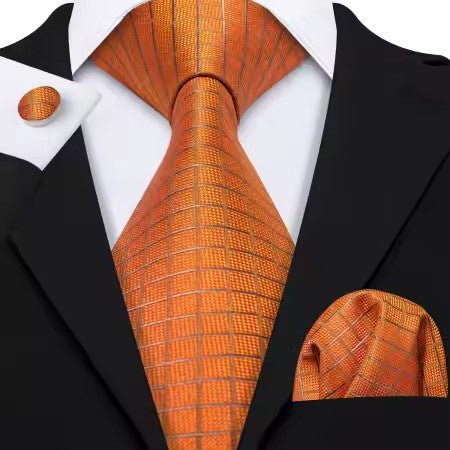 63-inch orange copper grid silk tie set with matching pocket square and cufflinks.”