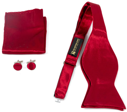 Self-tie Burgundy silk bow tie set for men, includes adjustable bow tie, 8.5-inch matching pocket square, and cufflinks in a gift box. Elegant accessory for formal events or gift-giving.
