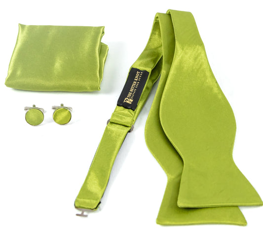 Self-tie Moss Green silk bow tie set for men, includes adjustable bow tie, 8.5-inch matching pocket square, and cufflinks in a gift box. Elegant accessory for formal events or gift-giving.