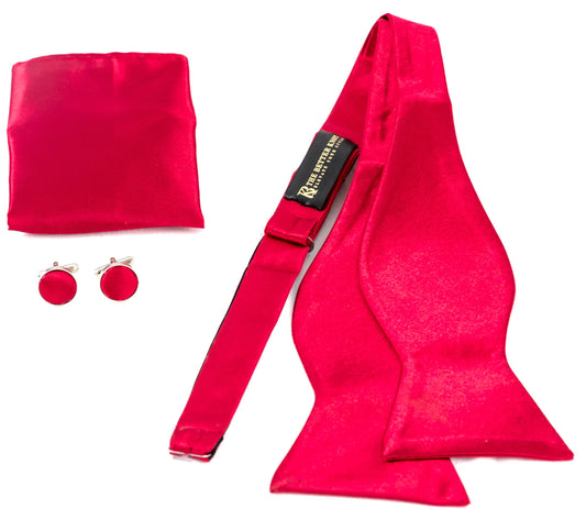 Self-tie Red silk bow tie set for men, includes adjustable bow tie, 8.5-inch matching pocket square, and cufflinks in a gift box. Elegant accessory for formal events or gift-giving.